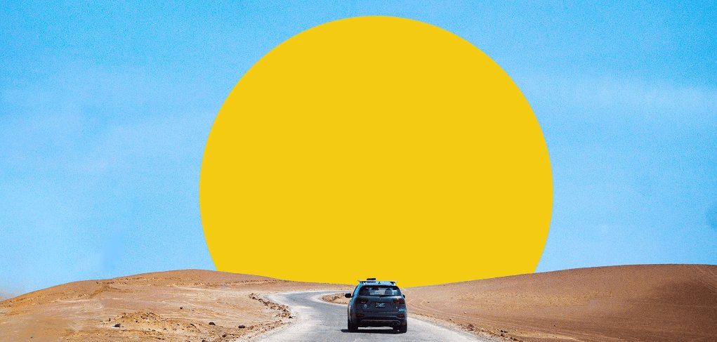 Car driving on a desert road in Botswana
